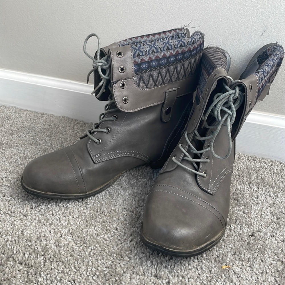 Black leather boots with Aztec design detail